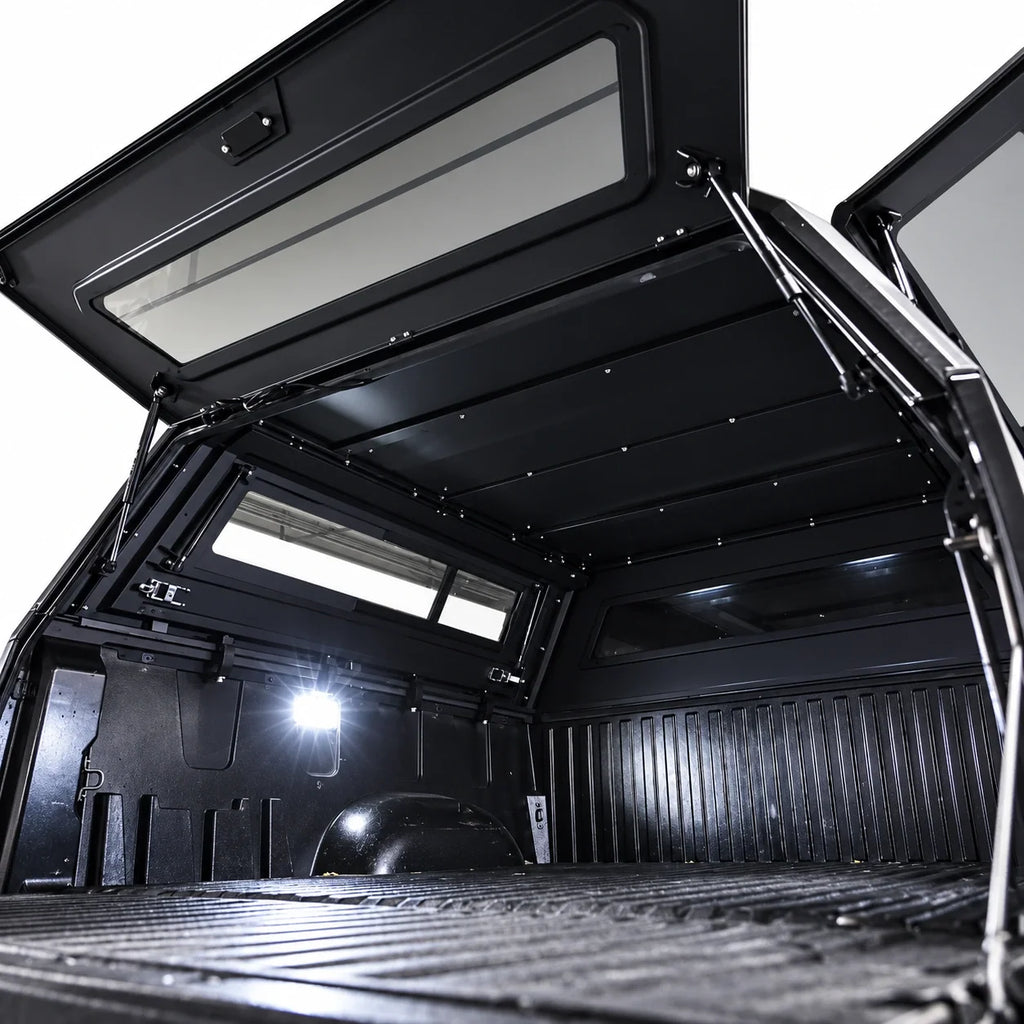 atlas expedition truck canopy with all 3 gullwing doors open and views from inside of the bed rails