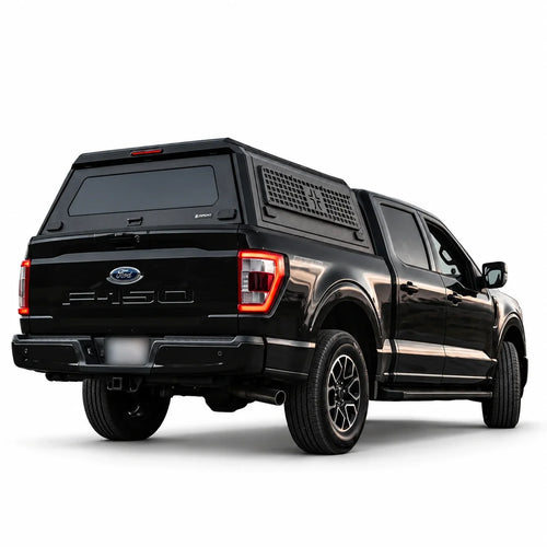 atlas expedition with grid truck cap and side molle panels on a black ford f150 truck