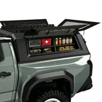 truck cap side storage box for truck canopies on a white background installed on a truck cap driver side