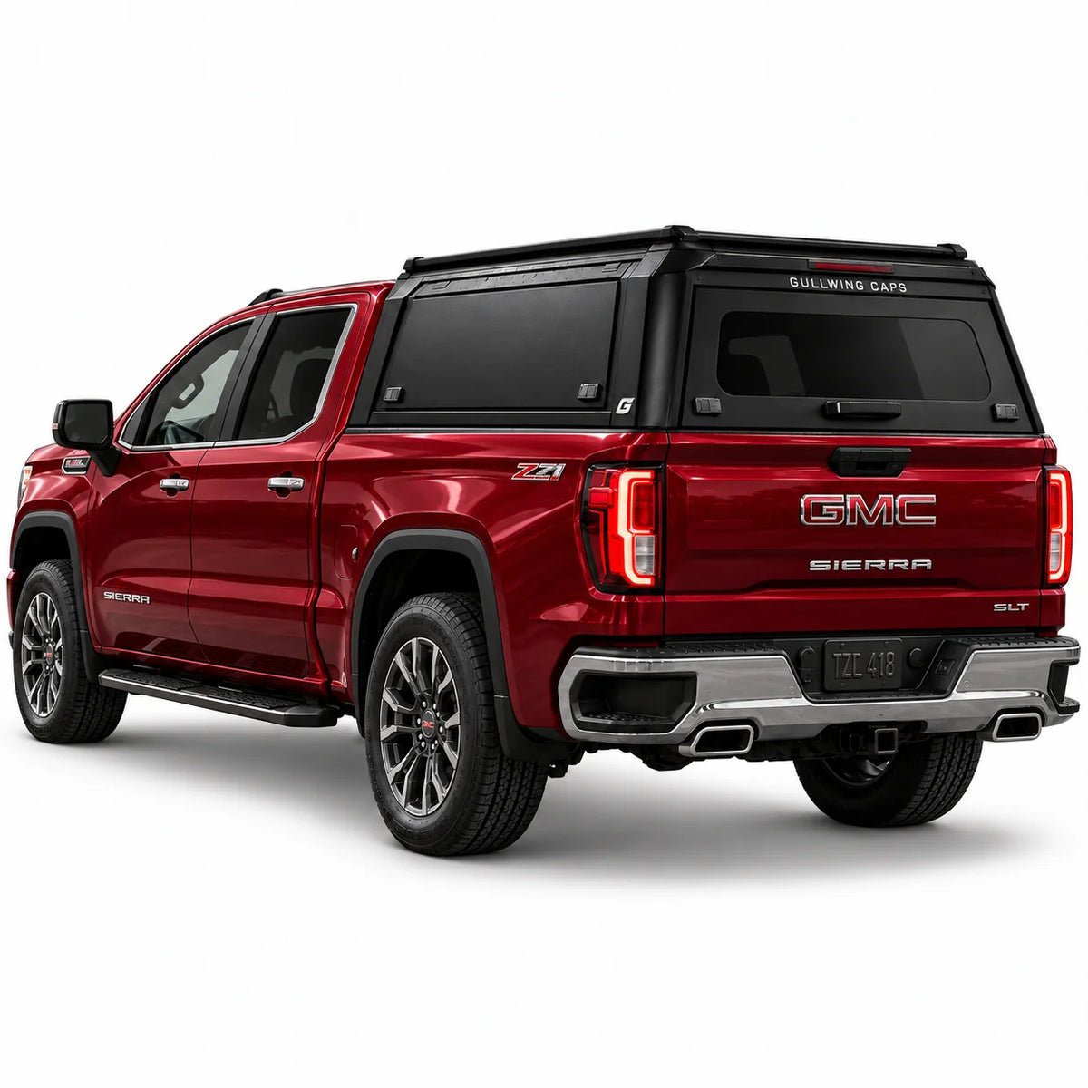A red GMC Sierra 1500 pickup truck shown from a rear three-quarter angle, fitted with a black Gullwing Caps aerowing truck canopy, set against a plain white studio background.